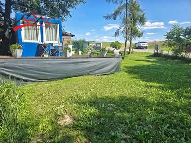Na predaj pozemok, Tužina